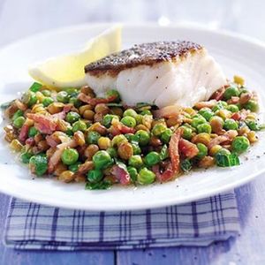 Braised peas with bacon, lentils & cod