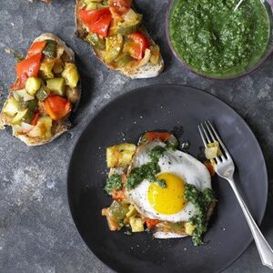 Braised summer vegetable pisto with emerald sauce & fried egg