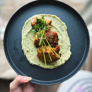 Crispy Chicken Thighs Over Bean Mash