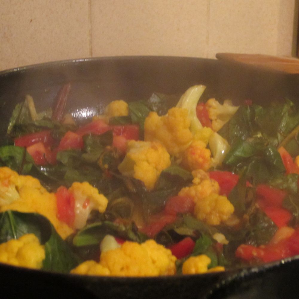 Greens with garlic, tomatoes and wine