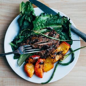 Grilled Salad with Romaine, Peaches, Garlic Scapes, and Steak