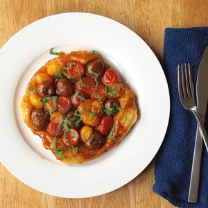 Individual tomato tarte tatin with pomegranate and mint