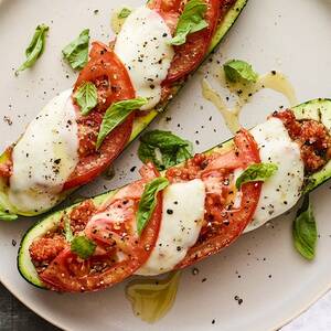 Quinoa, Mozzarella, and Tomato Zucchini Boats