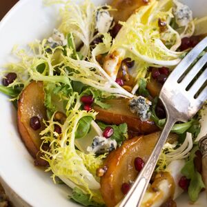 Roasted Pear Salad With Endive, Pomegranate, Blue Cheese, and Hazelnut Vinaigrette Recipe