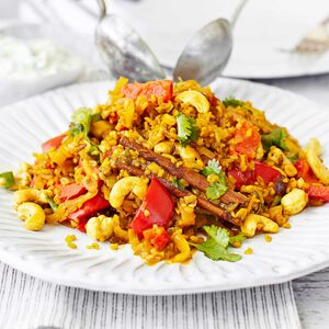 Spicy vegetable pilau with cucumber raita